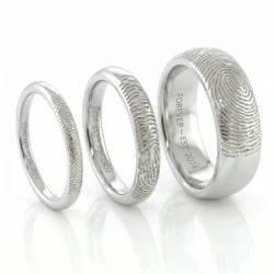 3 sterling silver fingerprint rings in various sizes with engraving on the inside