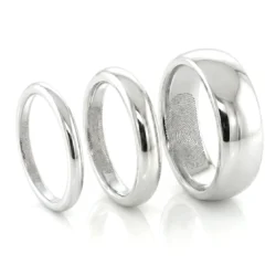 A set of nine carat white gold fingerprint band rings The fingerprints are on the inside of the band
