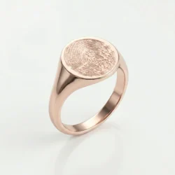 A 9 carat yellow gold signet ring with a fingerprint on top